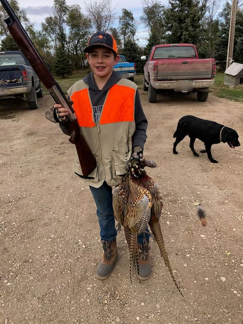 Carson from Pierre with Rooster pheasants